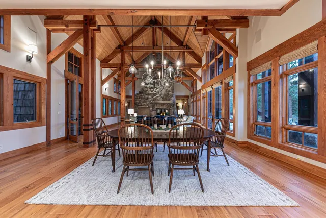 a dining room with furniture and wooden floor