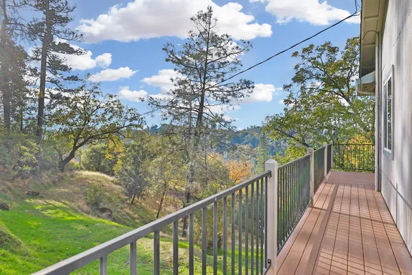 a view of a balcony with wooden floor