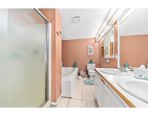 134 Summit Road Abington, MA 02351 - Photo 13 of 22 a bathroom with a sink a mirror and a toilet