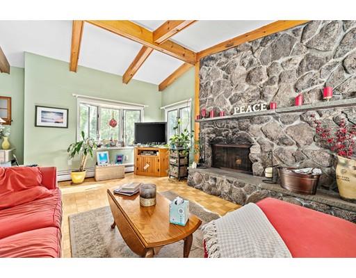 134 Summit Road Abington, MA 02351 - Photo 3 of 22 a living room with furniture a flat screen tv and a fireplace