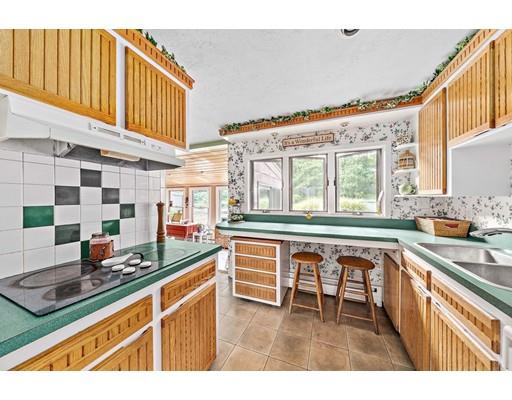 134 Summit Road Abington, MA 02351 - Photo 5 of 22 a kitchen with a sink stove and cabinets