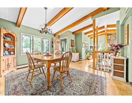 134 Summit Road Abington, MA 02351 - Photo 7 of 22 a dining room with furniture a chandelier and wooden floor