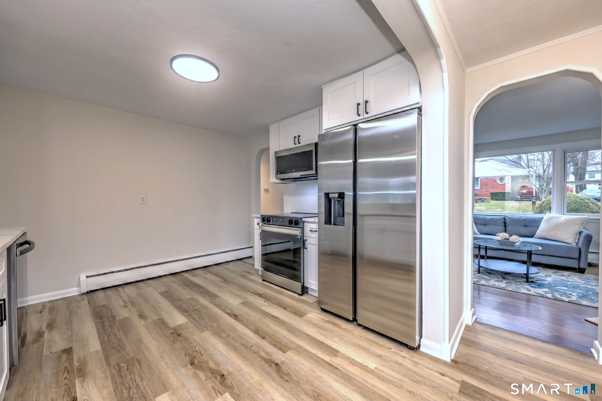 19 Harding Avenue West Haven, CT 06516 - Photo 15 of 39 a kitchen with a refrigerator and table