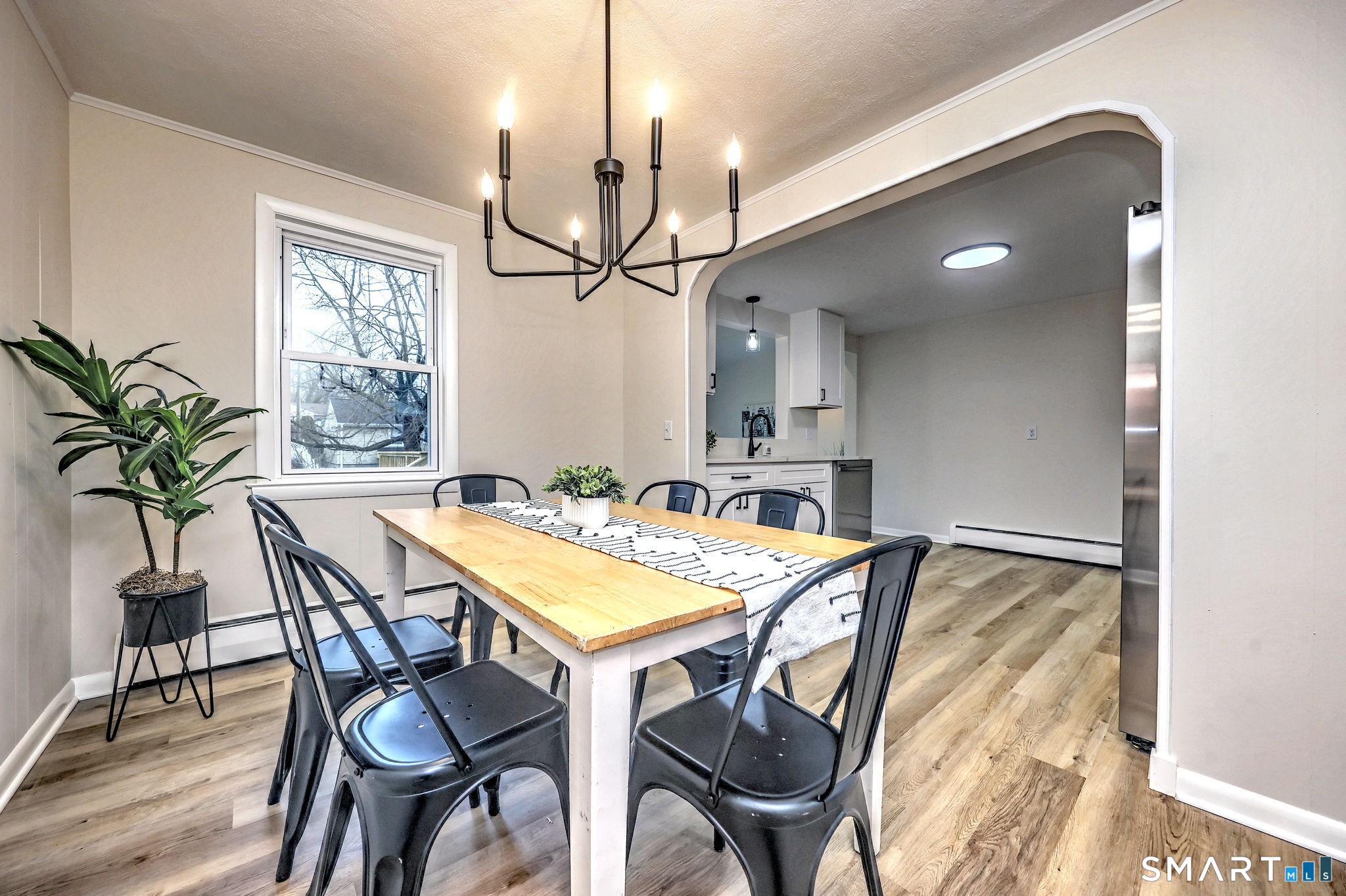 19 Harding Avenue West Haven, CT 06516 - Photo 21 of 39 a view of a dining room with furniture and a chandelier