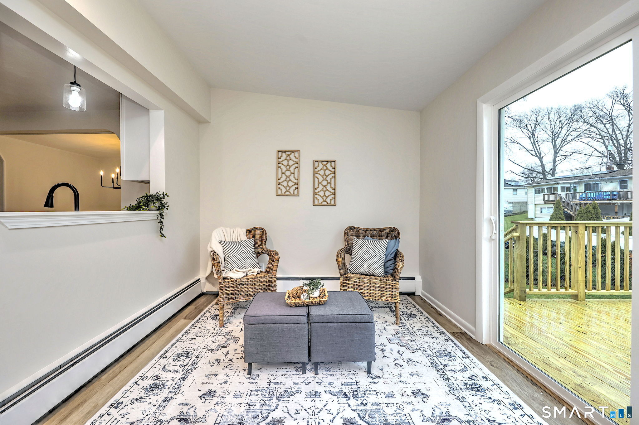 19 Harding Avenue West Haven, CT 06516 - Photo 23 of 39 a living room with furniture and a floor to ceiling window