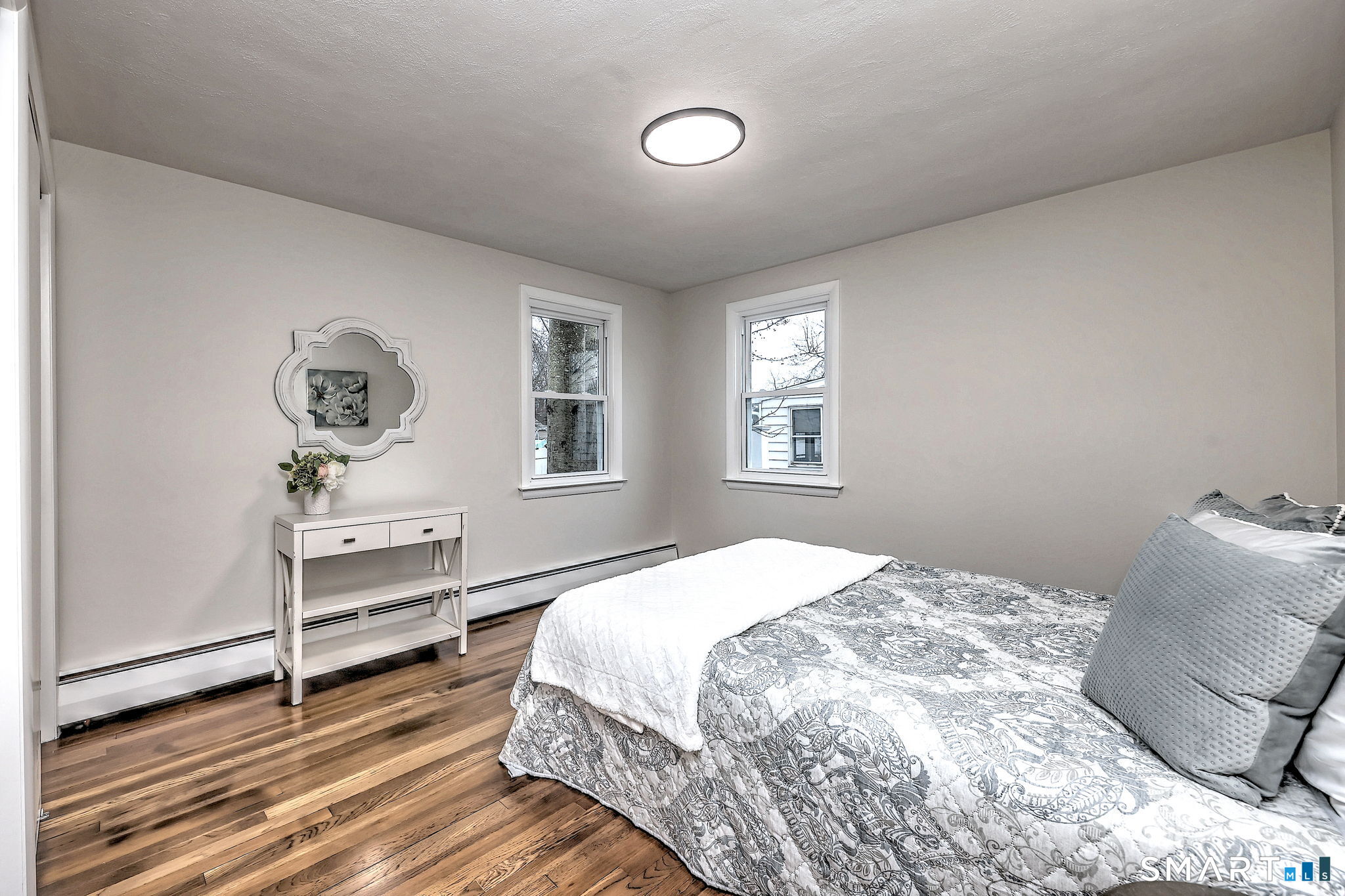 19 Harding Avenue West Haven, CT 06516 - Photo 26 of 39 a bedroom with a bed and wooden floor
