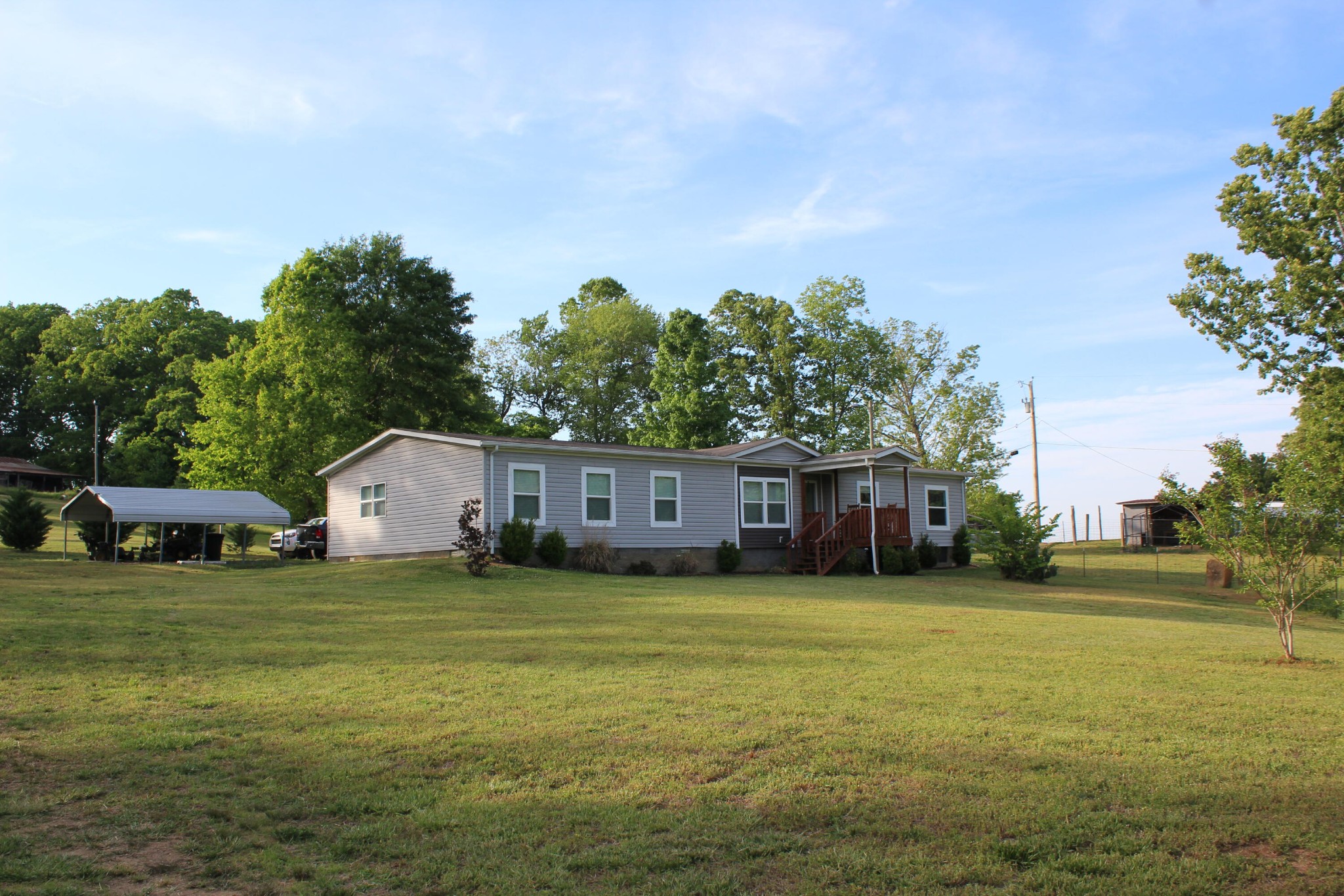 658 Stone Road Benton, TN 37307 - Photo 30 of 30 a view of a house with a yard and trees