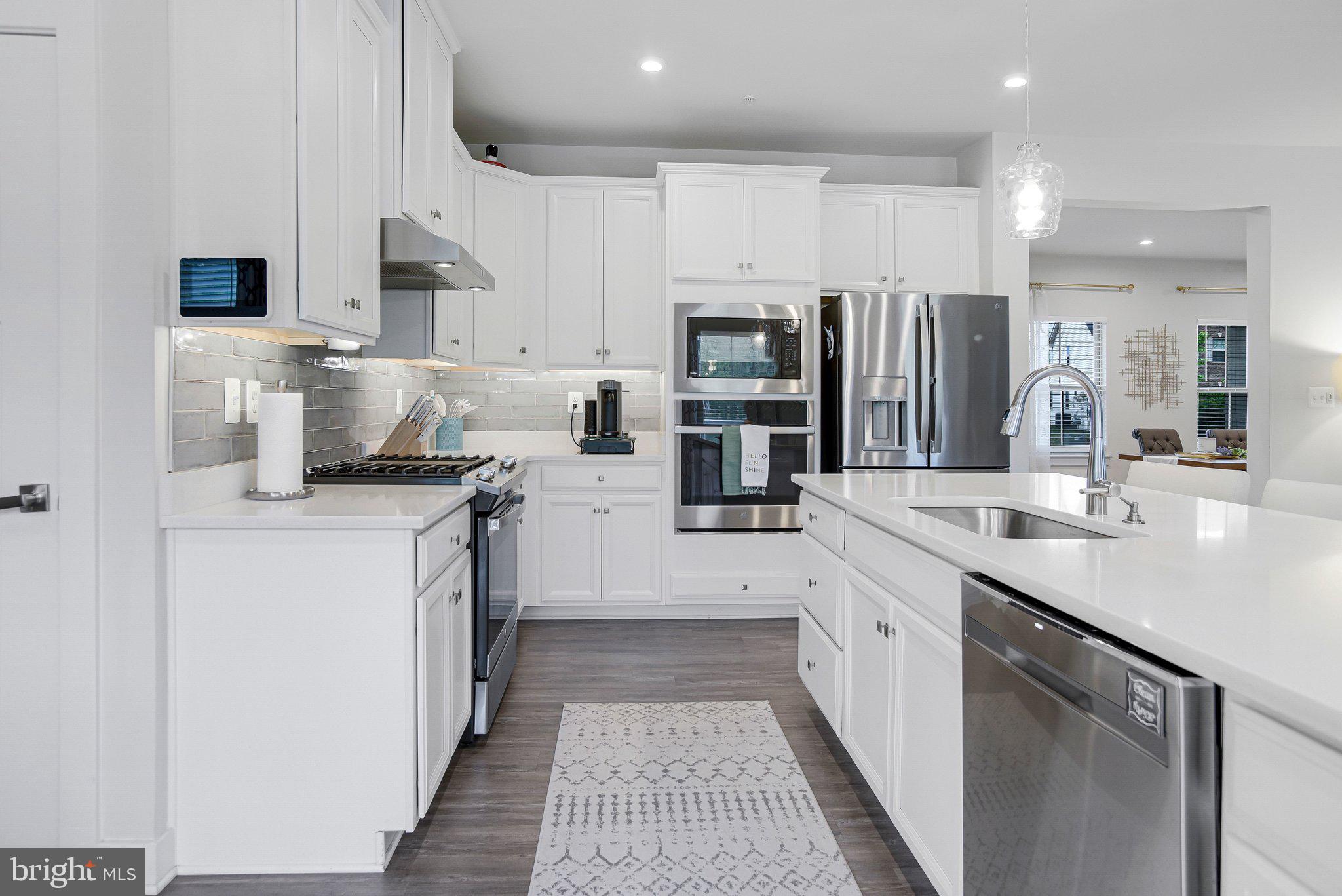 3917 Emory Ridge Road Brandywine, MD 20613 - Photo 13 of 60 Sleek modern kitchen with bright finishes.
