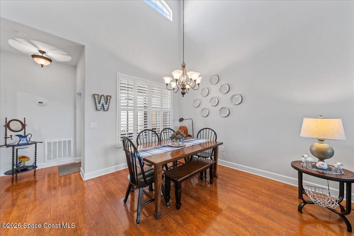 3210 Arden Circle Melbourne, FL 32934 - Photo 10 of 42 a view of a dining room with furniture and wooden floor