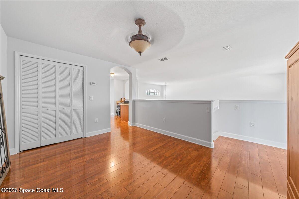 3210 Arden Circle Melbourne, FL 32934 - Photo 22 of 42 a view of a livingroom with wooden floor