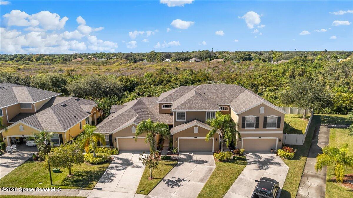 3210 Arden Circle Melbourne, FL 32934 - Photo 32 of 42 a aerial view of a house with a garden