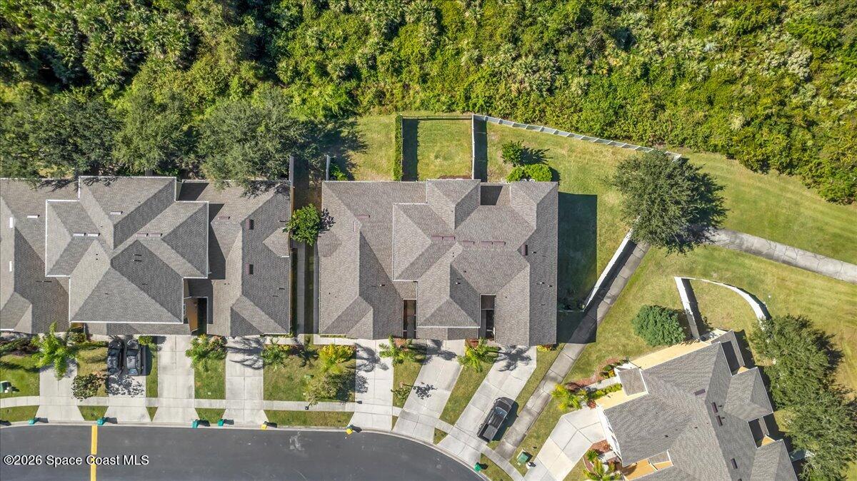 3210 Arden Circle Melbourne, FL 32934 - Photo 37 of 42 an aerial view of a house with a yard and large trees