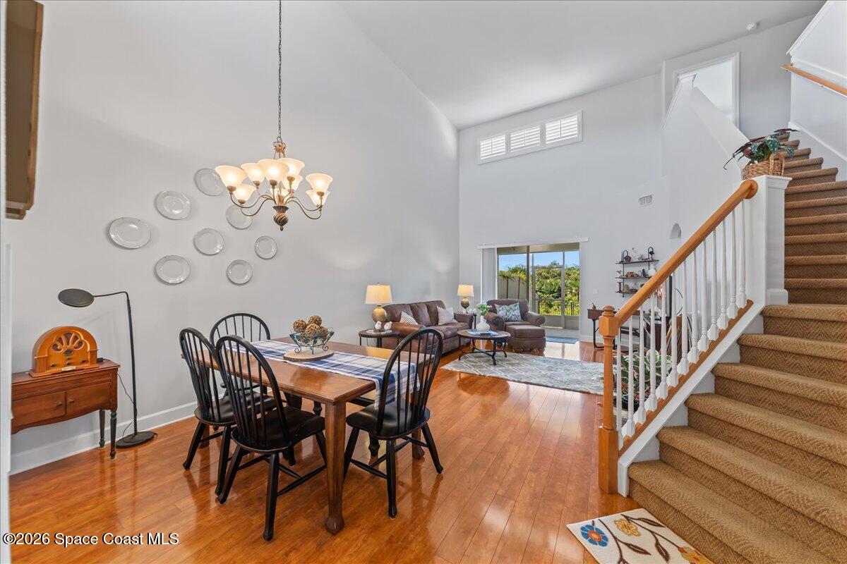 3210 Arden Circle Melbourne, FL 32934 - Photo 4 of 42 a view of a dining room with furniture wooden floor and chandelier