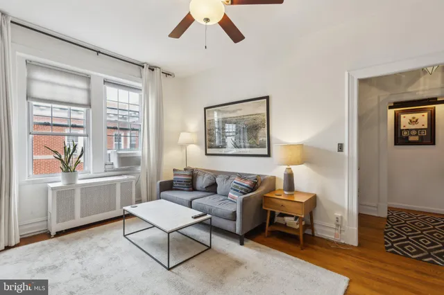a living room with furniture and a window
