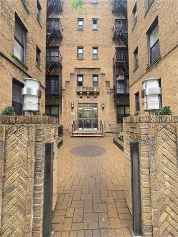 a front view of a building with a street