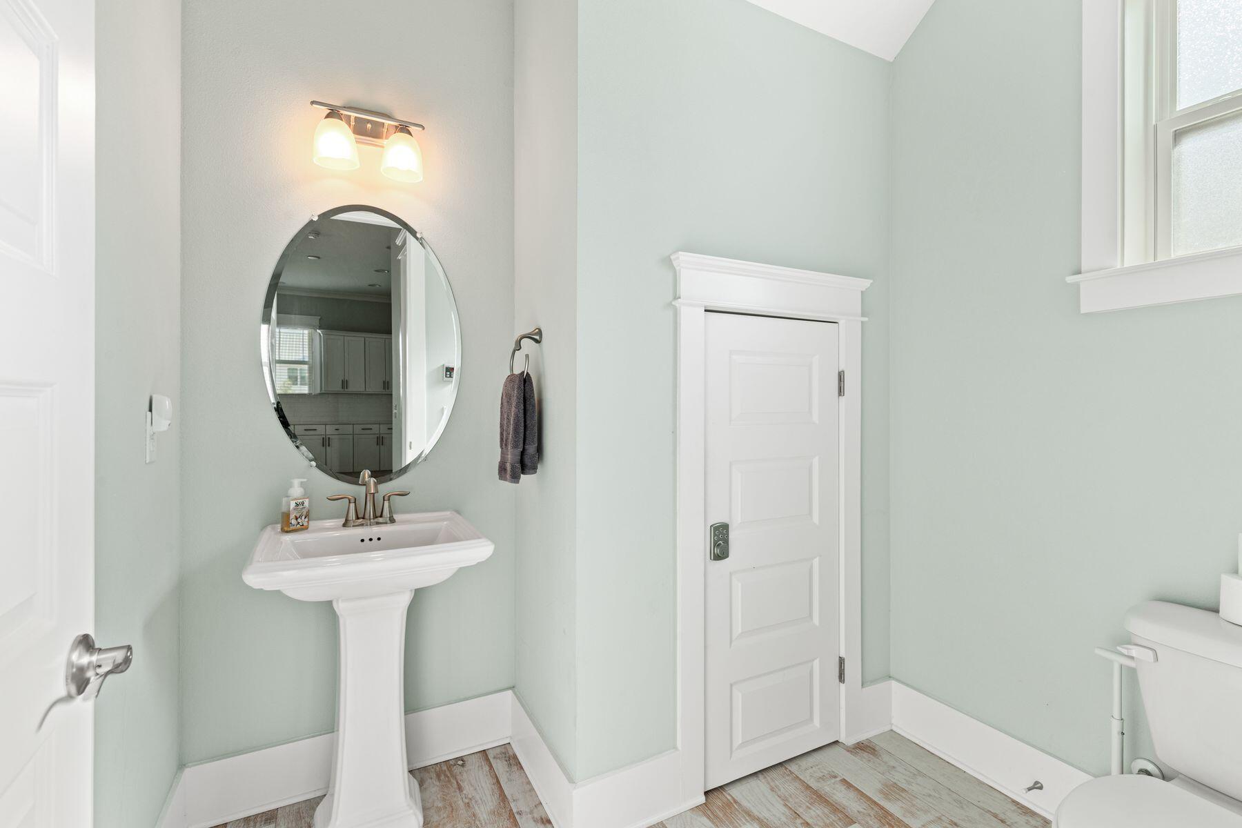 15 Cam Cove Inlet Beach Inlet Beach, FL 32461 - Photo 12 of 35 a bathroom with a sink toilet and a mirror