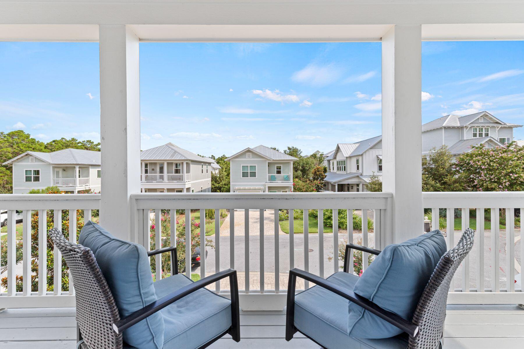 15 Cam Cove Inlet Beach Inlet Beach, FL 32461 - Photo 16 of 35 a view of a city from a balcony with furniture
