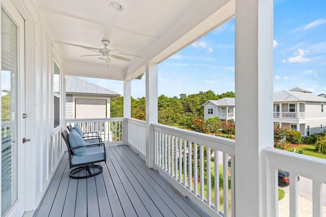 a view of a balcony with furniture