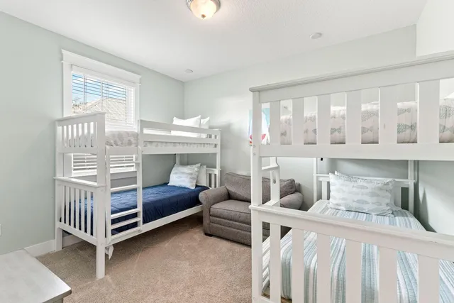 a bedroom with furniture and a window