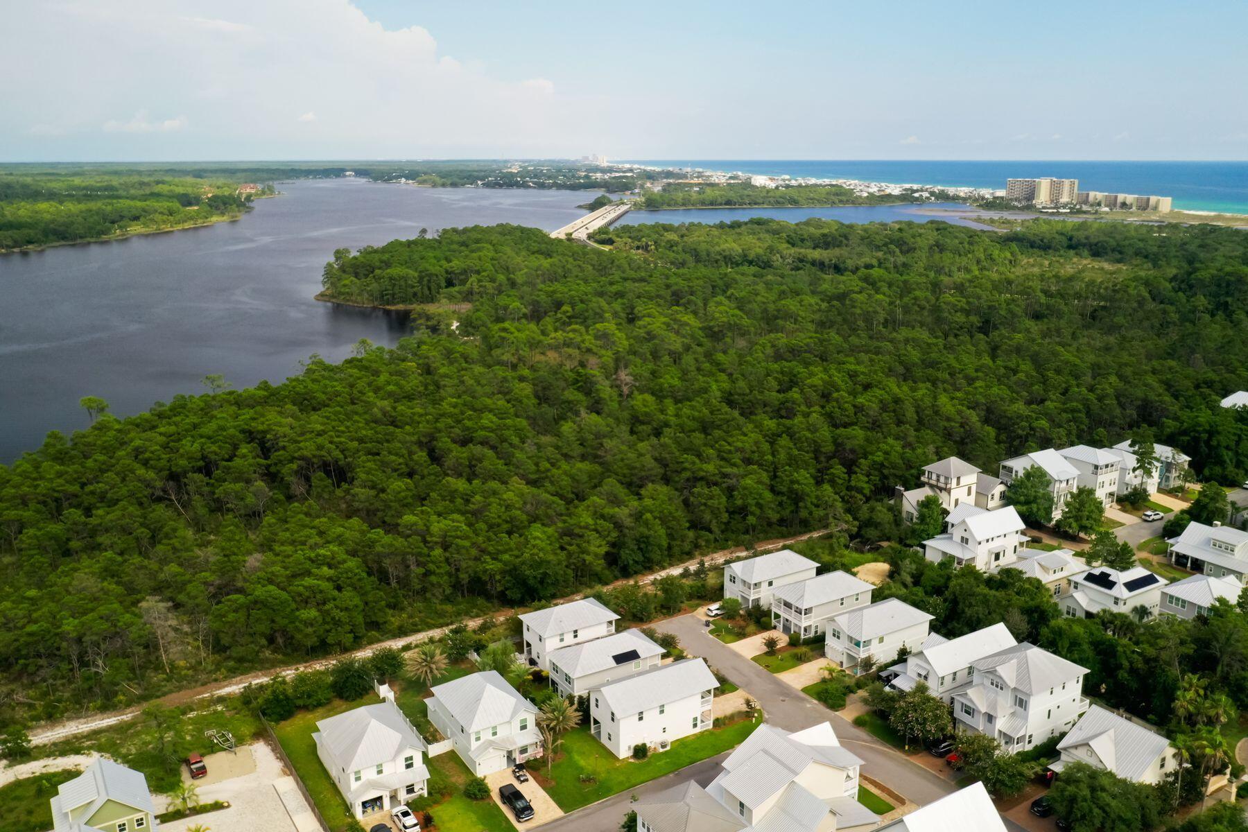 15 Cam Cove Inlet Beach Inlet Beach, FL 32461 - Photo 28 of 35 a view of a lake with lawn chairs