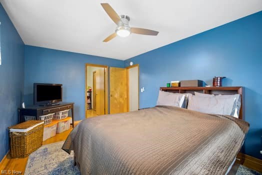 4618 South Arlington Road Uniontown, OH 44685 - Photo 24 of 31 Bedroom with ceiling fan and wood-type flooring