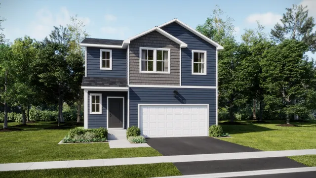 a front view of a house with a yard and trees