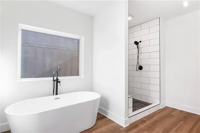a white bath tub sitting in a bathroom