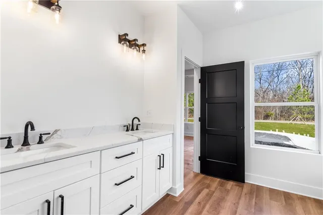 a bathroom with a sink and a mirror