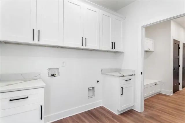 a view of cabinets and wooden floor