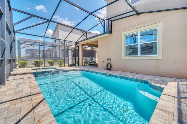 a view of a backyard with sitting area