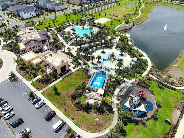 an aerial view of a house yard and swimming pool