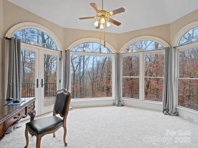 a view of a livingroom with furniture and a window