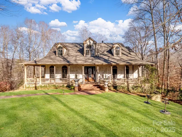 a view of a yard with large trees