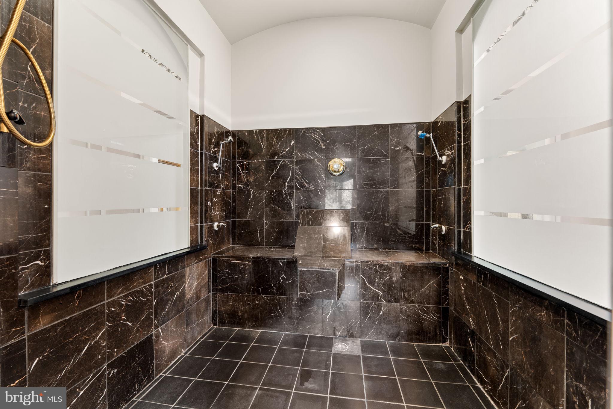 10613 Frank Tippett Road Cheltenham, MD 20623 - Photo 15 of 62 a bathroom with a glass door shower