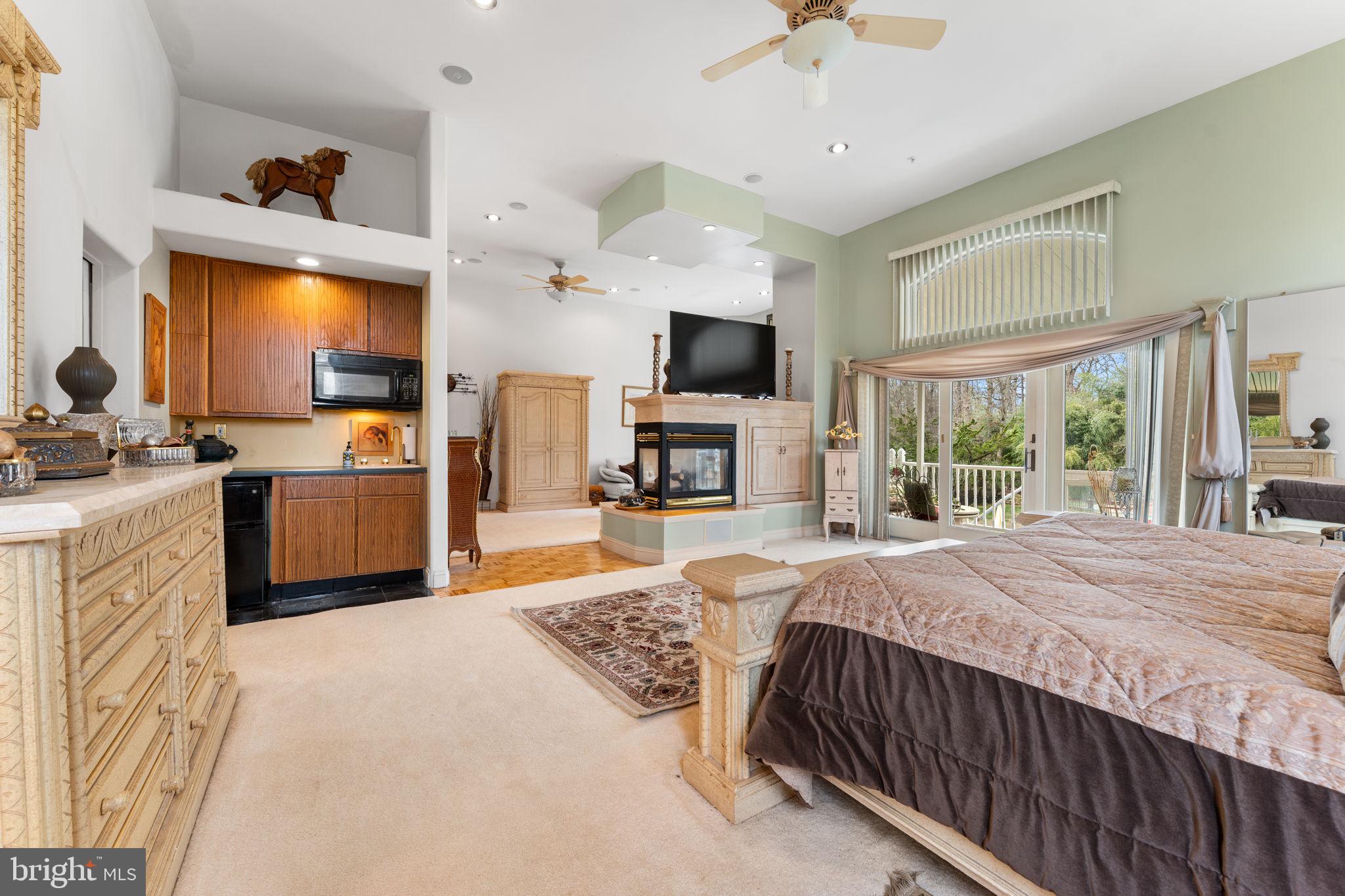 10613 Frank Tippett Road Cheltenham, MD 20623 - Photo 17 of 62 a bed room with a bed and a television