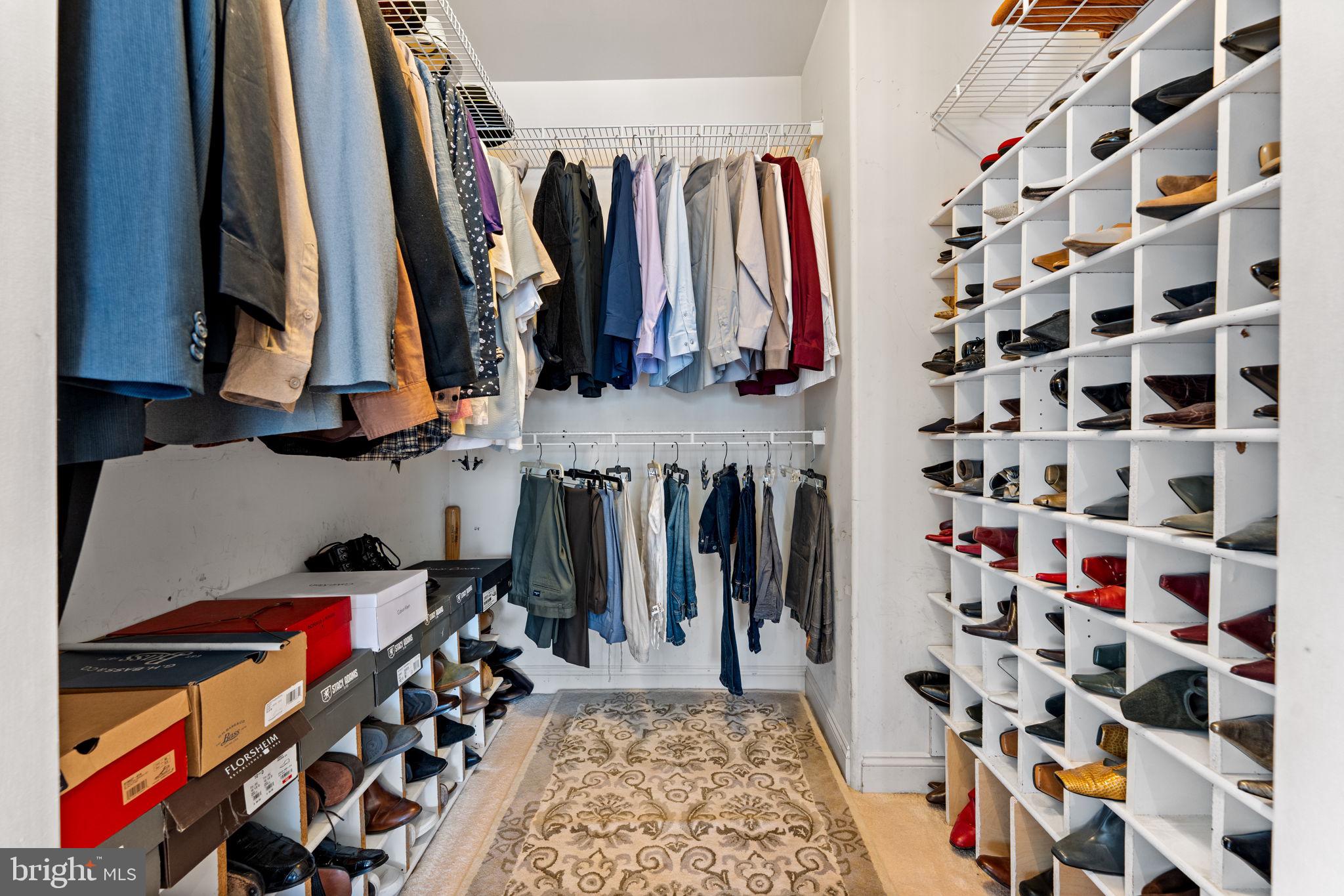 10613 Frank Tippett Road Cheltenham, MD 20623 - Photo 20 of 62 a view of walk in closet with clothes and shoes