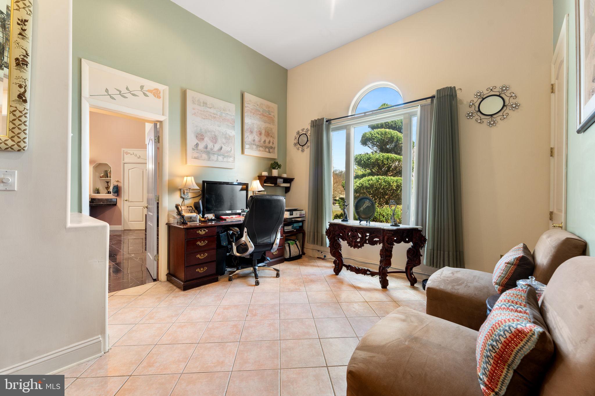 10613 Frank Tippett Road Cheltenham, MD 20623 - Photo 3 of 62 a living room with furniture and a floor to ceiling window