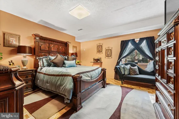a living room with furniture gym equipment and a flat screen tv