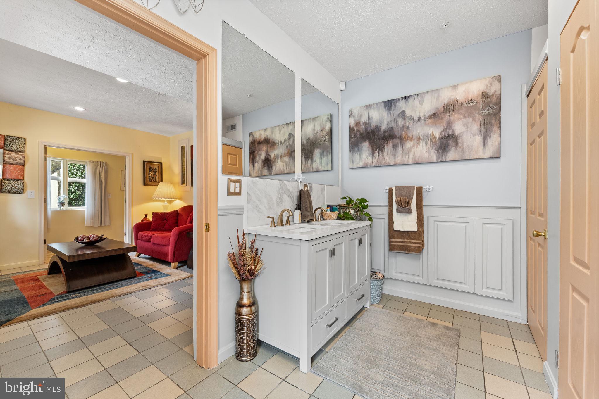 10613 Frank Tippett Road Cheltenham, MD 20623 - Photo 32 of 62 a utility room with stainless steel appliances kitchen island granite countertop a refrigerator and a cabinets