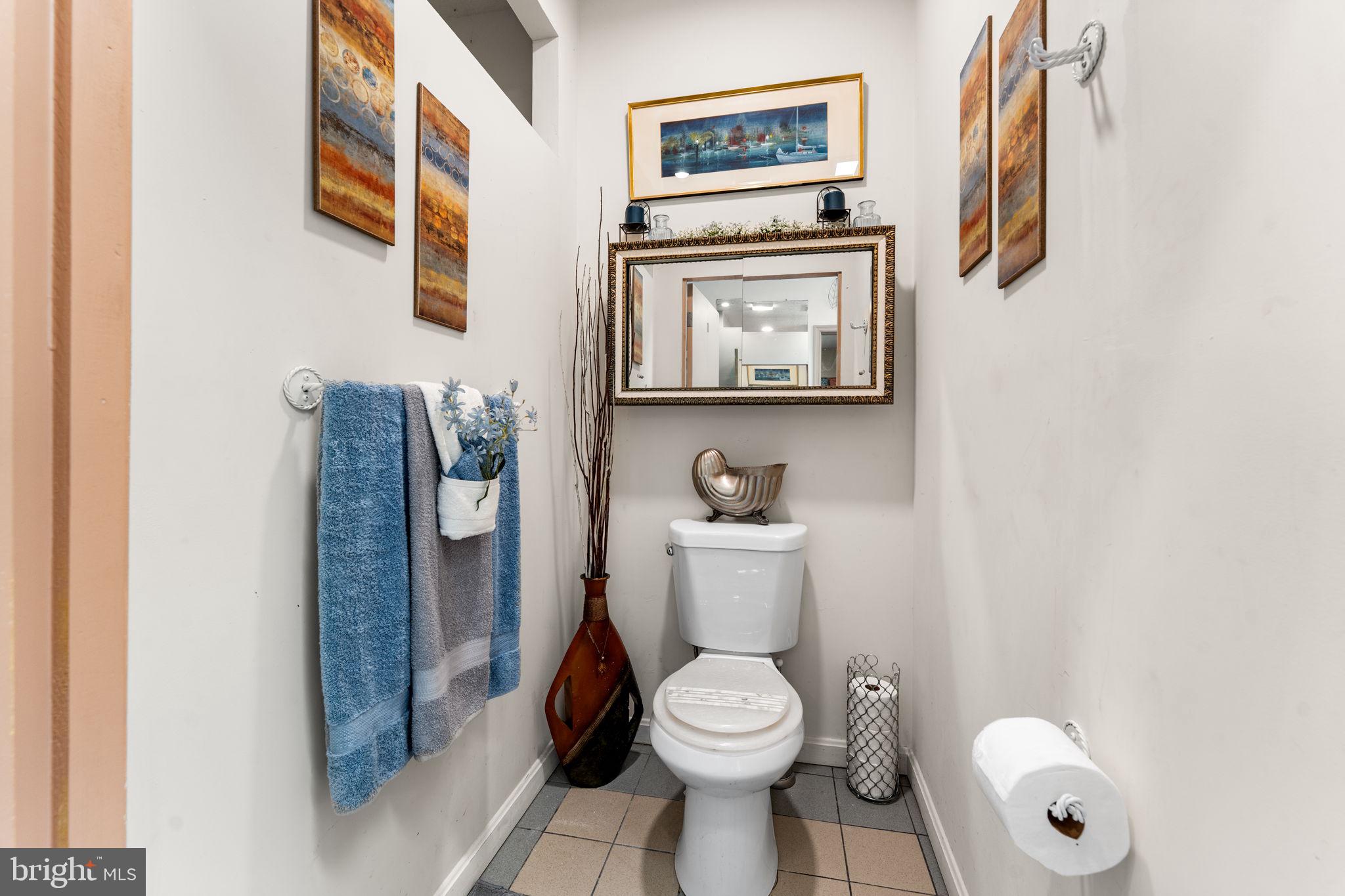 10613 Frank Tippett Road Cheltenham, MD 20623 - Photo 33 of 62 a white toilet sitting next to a bathroom sink