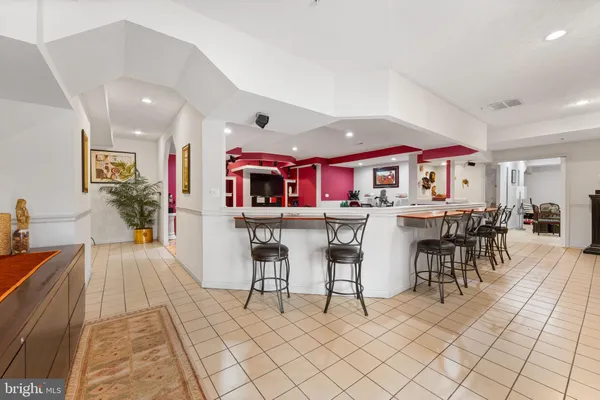 a view of a patio with couches chairs and a fire pit