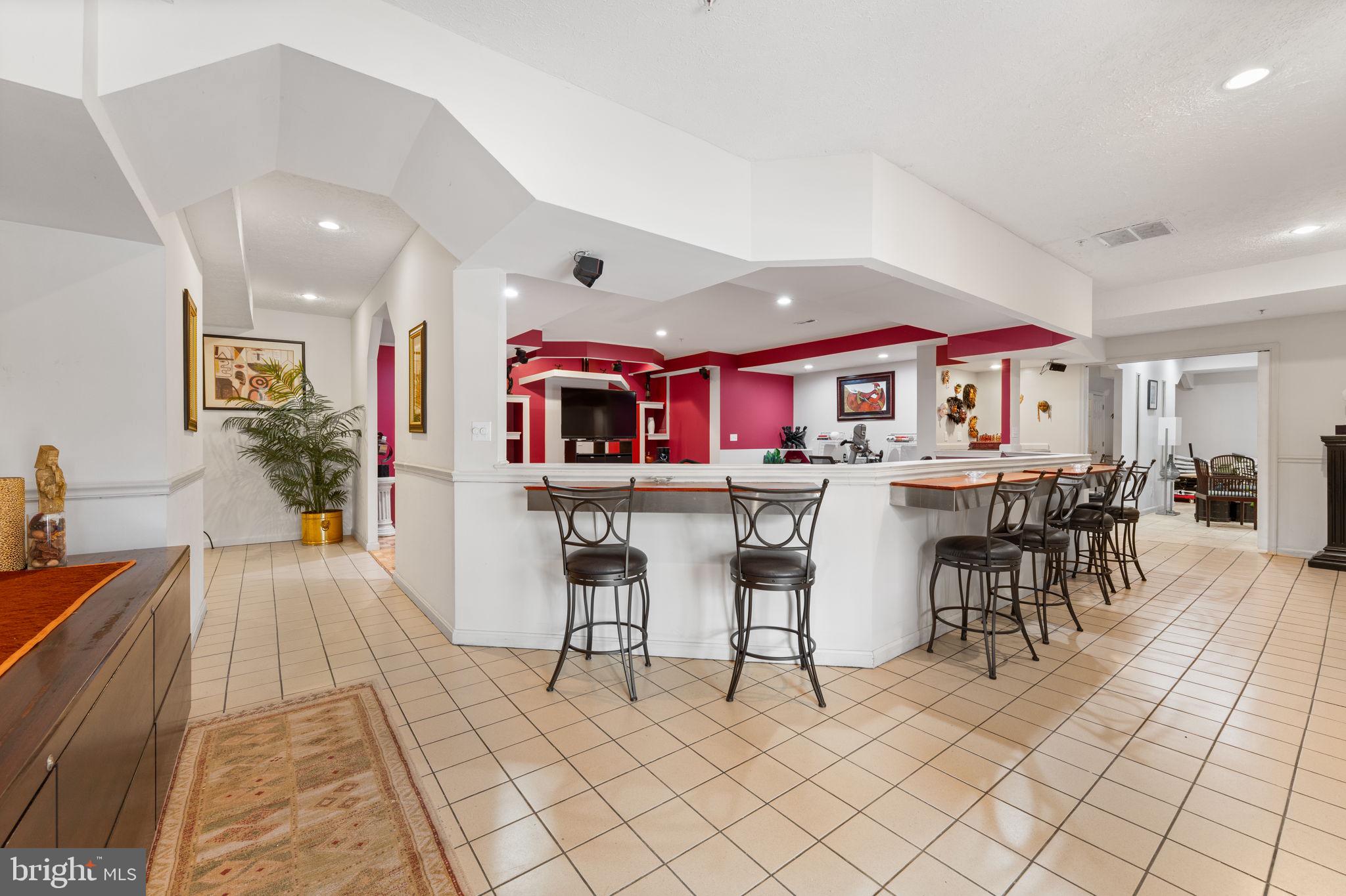 10613 Frank Tippett Road Cheltenham, MD 20623 - Photo 39 of 62 a living room with stainless steel appliances kitchen island granite countertop furniture and a view of kitchen
