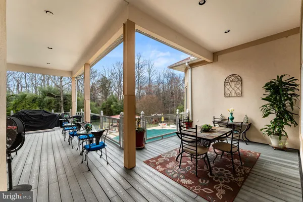 a view of a house with backyard and trees