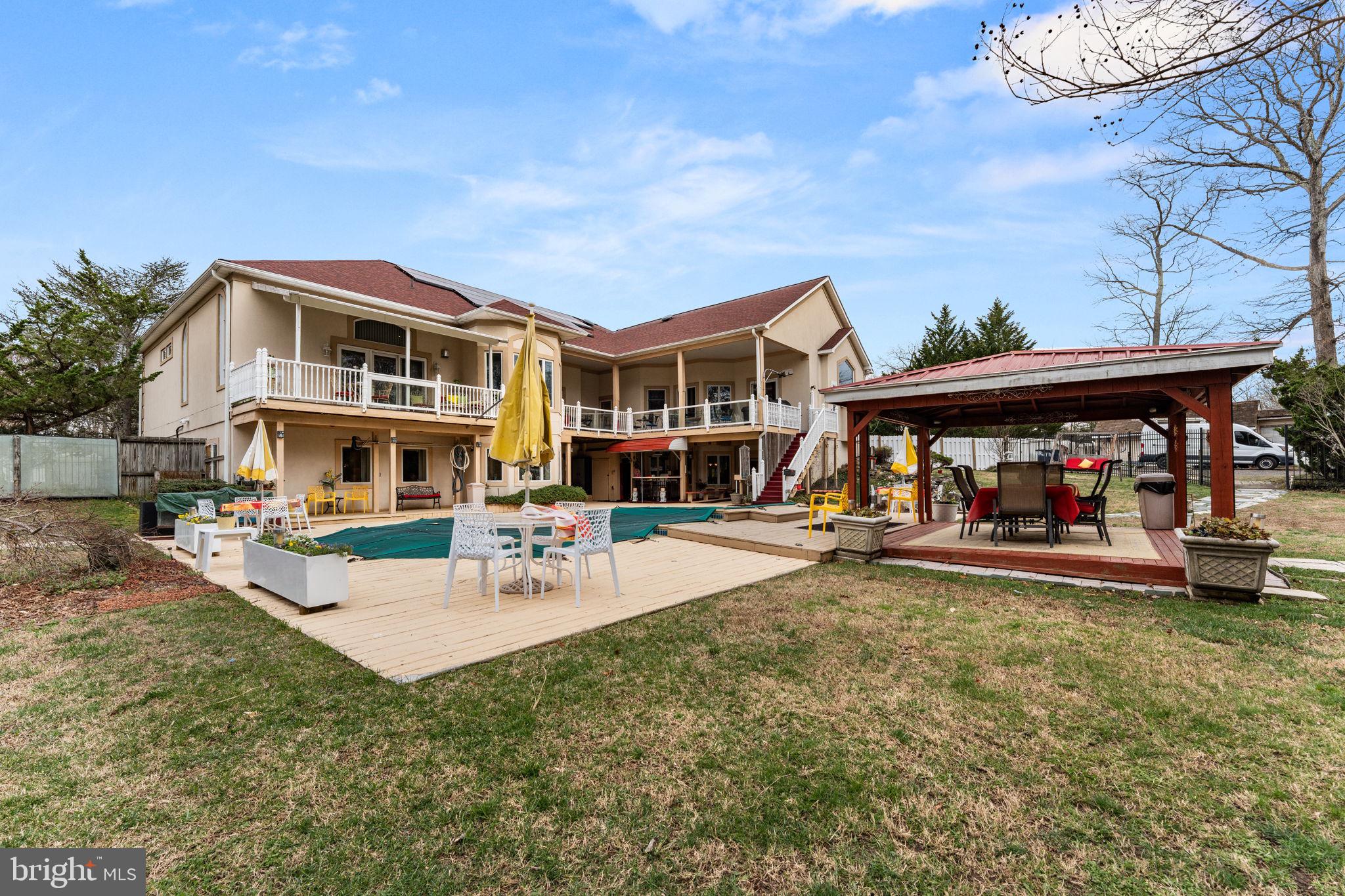 10613 Frank Tippett Road Cheltenham, MD 20623 - Photo 55 of 62 a view of a house with swimming pool and sitting area