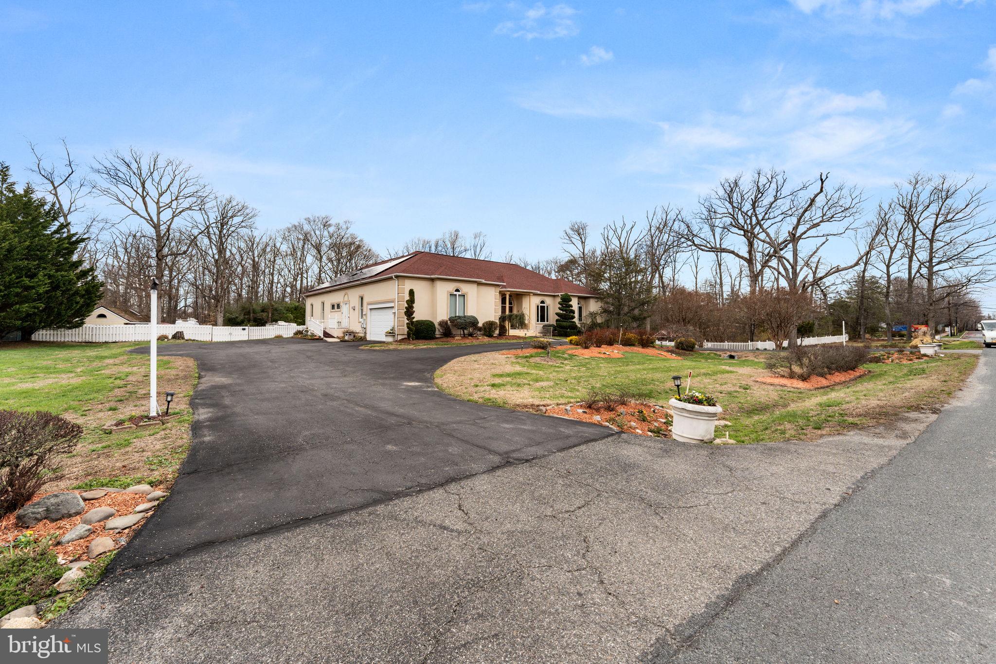 10613 Frank Tippett Road Cheltenham, MD 20623 - Photo 58 of 62 a view of swimming pool with lawn chairs and large trees