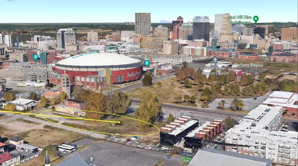 an aerial view of a city with parking