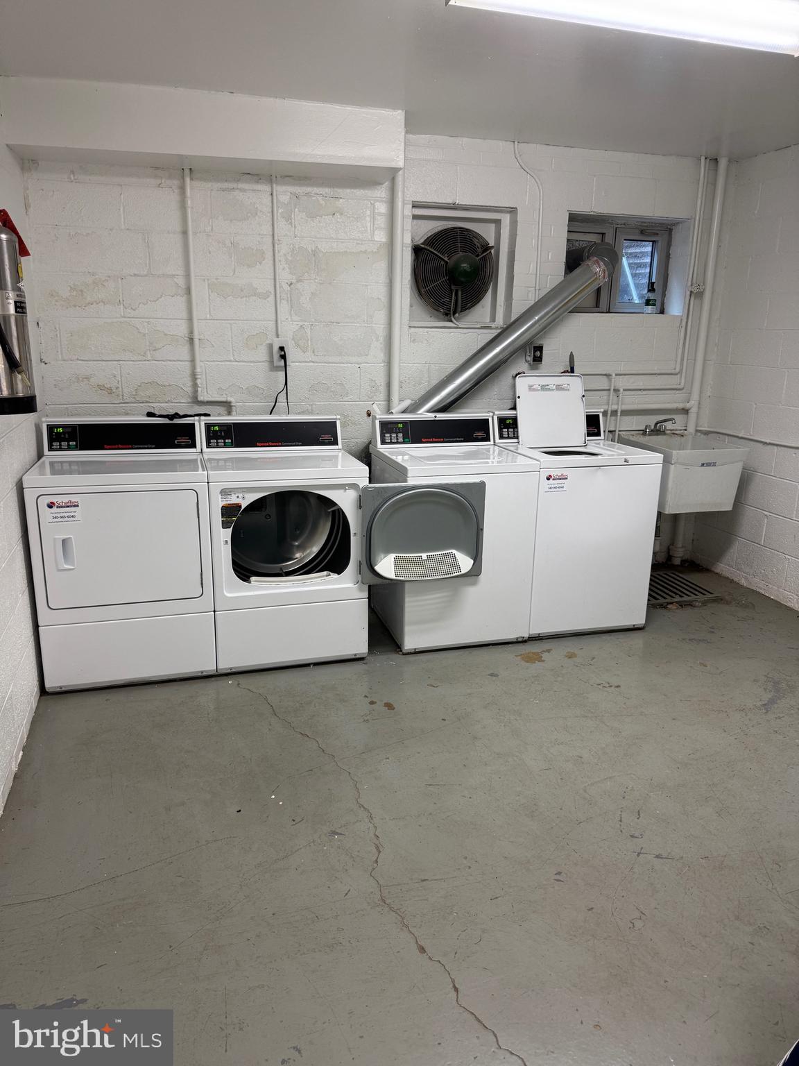 10524 Weymouth Street, Unit W1 Bethesda, MD 20814 - Photo 15 of 18 a utility room with dryer and washer