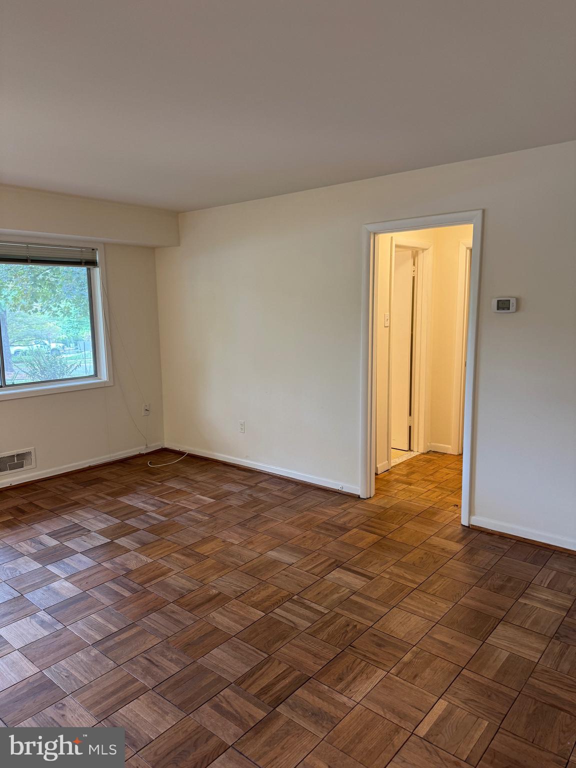 10524 Weymouth Street, Unit W1 Bethesda, MD 20814 - Photo 6 of 18 an empty room with windows