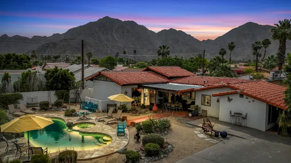 a view of a swimming pool with a patio