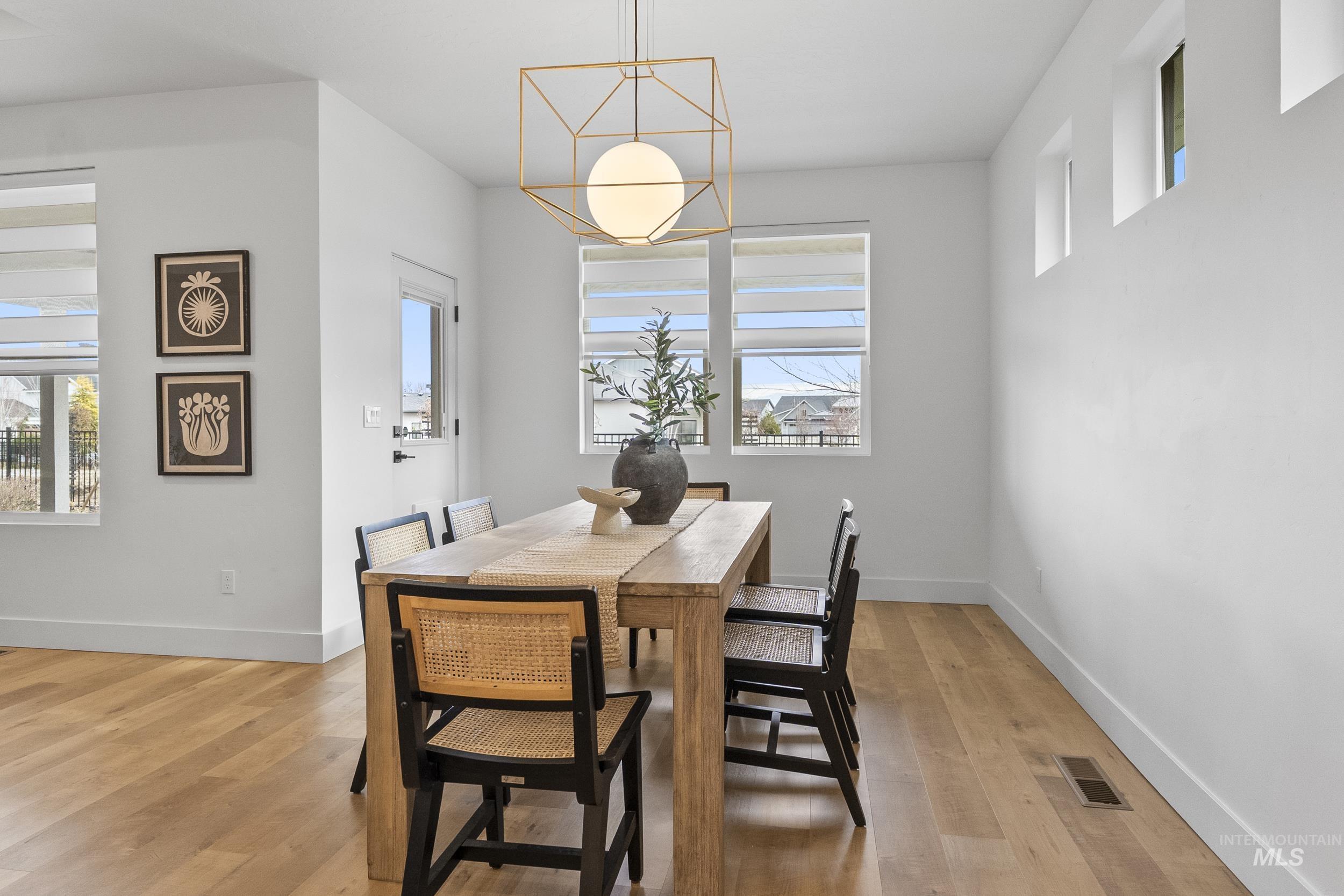 4320 South Selatir Way Meridian, ID 83642 - Photo 18 of 44 Dining area with baseboards and light wood-style flooring